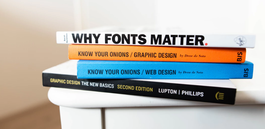Stack of graphic design and web design books.